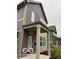Attractive two-story home with a covered porch, gray siding, and modern architectural details at 1215 Herbert St, Indianapolis, IN 46202