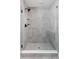 Modern shower with glass door and gray tile surround at 1215 Herbert St, Indianapolis, IN 46202