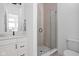 Modern bathroom with a glass-enclosed shower, sleek vanity, and minimalist design at 127 Monon Green Blvd, Carmel, IN 46032
