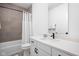 Bright bathroom features a tub shower combination, modern vanity, and stylish mirror at 127 Monon Green Blvd, Carmel, IN 46032
