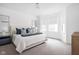 Serene bedroom with plush bedding, light-filled windows, and neutral tones at 127 Monon Green Blvd, Carmel, IN 46032