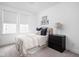 Bright bedroom features two windows, a soft color palette, and modern decor, creating a peaceful retreat at 127 Monon Green Blvd, Carmel, IN 46032