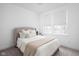 Cozy bedroom featuring a comfortable bed, neutral decor, and bright windows at 127 Monon Green Blvd, Carmel, IN 46032