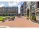 Beautiful brick courtyard featuring a central fountain, seating, and manicured landscaping for residents to enjoy at 127 Monon Green Blvd, Carmel, IN 46032