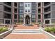 Beautiful courtyard featuring a fountain, seating, and landscaping, creating a tranquil outdoor space at 127 Monon Green Blvd, Carmel, IN 46032
