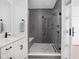 Elegant tiled shower with glass enclosure, bench, and modern fixtures at 127 Monon Green Blvd, Carmel, IN 46032