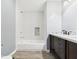 Well-appointed bathroom with a dark wood vanity, white tiles, and contemporary design elements at 1356 S Catamaran Cir, Cicero, IN 46034