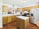Spacious kitchen with wood cabinets, stainless steel appliances, and a center island perfect for meal preparation at 1356 S Catamaran Cir, Cicero, IN 46034