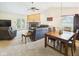 Bright living room with large windows, vaulted ceilings, and a cozy fireplace at 1356 S Catamaran Cir, Cicero, IN 46034