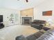 A comfortable living room with a fireplace and french doors leading to the backyard at 1356 S Catamaran Cir, Cicero, IN 46034