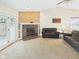 A comfortable living room with a fireplace and access to the outdoor deck at 1356 S Catamaran Cir, Cicero, IN 46034