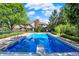 Expansive swimming pool and meticulously maintained backyard, perfect for outdoor enjoyment at 13827 Driftwood Dr, Carmel, IN 46033