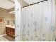 Bathroom featuring a shower with a decorative curtain and vanity at 13827 Driftwood Dr, Carmel, IN 46033