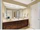 Bright bathroom with dual sinks, a large mirror, and stylish fixtures, providing a comfortable and functional space at 13827 Driftwood Dr, Carmel, IN 46033