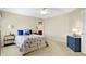 Serene bedroom with a nautical-themed bed, neutral carpet, and natural light at 13827 Driftwood Dr, Carmel, IN 46033