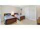 Comfortable bedroom with twin beds, nightstand, and neutral decor at 13827 Driftwood Dr, Carmel, IN 46033