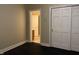 Bedroom with door to bathroom and large closet with white doors at 13827 Driftwood Dr, Carmel, IN 46033