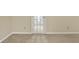 Bedroom with beige walls, carpet, and a door with glass panels at 13827 Driftwood Dr, Carmel, IN 46033