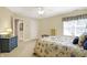 Cozy bedroom featuring carpet flooring, a ceiling fan, and a window with a blue checkered curtain at 13827 Driftwood Dr, Carmel, IN 46033