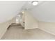 A spacious bonus room area with neutral carpet, white walls, and a ceiling fan at 13827 Driftwood Dr, Carmel, IN 46033