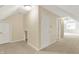Spacious bonus room features neutral carpet, white walls, and white doors at 13827 Driftwood Dr, Carmel, IN 46033