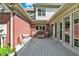 Inviting deck with seating, surrounded by brick exterior and offering a tranquil outdoor setting at 13827 Driftwood Dr, Carmel, IN 46033