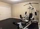 Exercise room with rubber flooring and a full weight training system at 13827 Driftwood Dr, Carmel, IN 46033