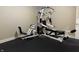 Exercise room with rubber flooring featuring a weight training system at 13827 Driftwood Dr, Carmel, IN 46033