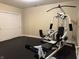 Exercise room with rubber flooring and a full weight training system at 13827 Driftwood Dr, Carmel, IN 46033