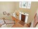 Elegant foyer with hardwood floors, chandelier, staircase, and detailed trim at 13827 Driftwood Dr, Carmel, IN 46033