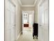 Hallway view leads to an open bathroom featuring a large soaking tub at 13827 Driftwood Dr, Carmel, IN 46033