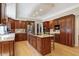 Spacious kitchen with custom cabinets, a center island with bar seating, and modern appliances at 13827 Driftwood Dr, Carmel, IN 46033
