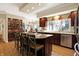 Large kitchen featuring a center island, hardwood floors, and an open layout connected to the dining area at 13827 Driftwood Dr, Carmel, IN 46033