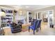 Living room showing fireplace, built-in bookcases, hardwood floors and comfortable seating at 13827 Driftwood Dr, Carmel, IN 46033