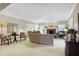 Spacious living room with fireplace, comfortable furniture, and neutral carpet at 13827 Driftwood Dr, Carmel, IN 46033