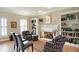 Living room with fireplace flanked by built-in bookshelves and comfy seating at 13827 Driftwood Dr, Carmel, IN 46033