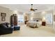 Elegant main bedroom featuring trey ceiling, neutral colors, and sitting area at 13827 Driftwood Dr, Carmel, IN 46033