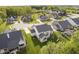 Expansive aerial view showcasing a backyard, mature trees and neighborhood pond at 14003 Grannan Ln, Carmel, IN 46074