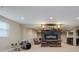 Finished basement area with fireplace, drumset, and wet bar at 14003 Grannan Ln, Carmel, IN 46074