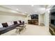 Spacious basement with bar and comfortable seating at 14003 Grannan Ln, Carmel, IN 46074