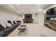 Finished basement with a bar, seating area, and an electric fireplace at 14003 Grannan Ln, Carmel, IN 46074