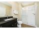 Bathroom featuring a glass door shower, vanity, and sink at 14003 Grannan Ln, Carmel, IN 46074