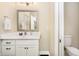 Powder room features a modern vanity with drawers, a framed mirror, and convenient access to the toilet at 14003 Grannan Ln, Carmel, IN 46074