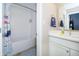 Bathroom featuring a tub, shower with white tiles, and modern vanity at 14003 Grannan Ln, Carmel, IN 46074