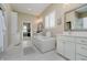 Bright bathroom with a standalone tub, double vanities, and elegant tile flooring at 14003 Grannan Ln, Carmel, IN 46074
