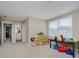 Bonus room with toy storage, a desk, and a view to an adjacent bathroom at 14003 Grannan Ln, Carmel, IN 46074