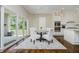Cozy breakfast nook with table and chairs situated near sliding glass doors to backyard at 14003 Grannan Ln, Carmel, IN 46074