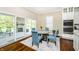 Bright dining area has sliding door access to the stone patio, and a view of the stainless kitchen appliances at 14003 Grannan Ln, Carmel, IN 46074