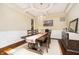 Formal dining room with elegant chandelier, wainscoting, and stylish decor for sophisticated entertaining at 14003 Grannan Ln, Carmel, IN 46074