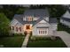 Front exterior of well-maintained property showcasing architectural details, landscaping, and a welcoming entrance at 14003 Grannan Ln, Carmel, IN 46074